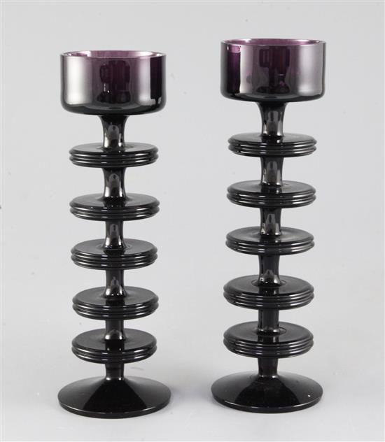 Ronald Stennett-Willson for Wedgwood. Two Sheringham five disc amethyst glass candlesticks, 22.5cm and 22cm